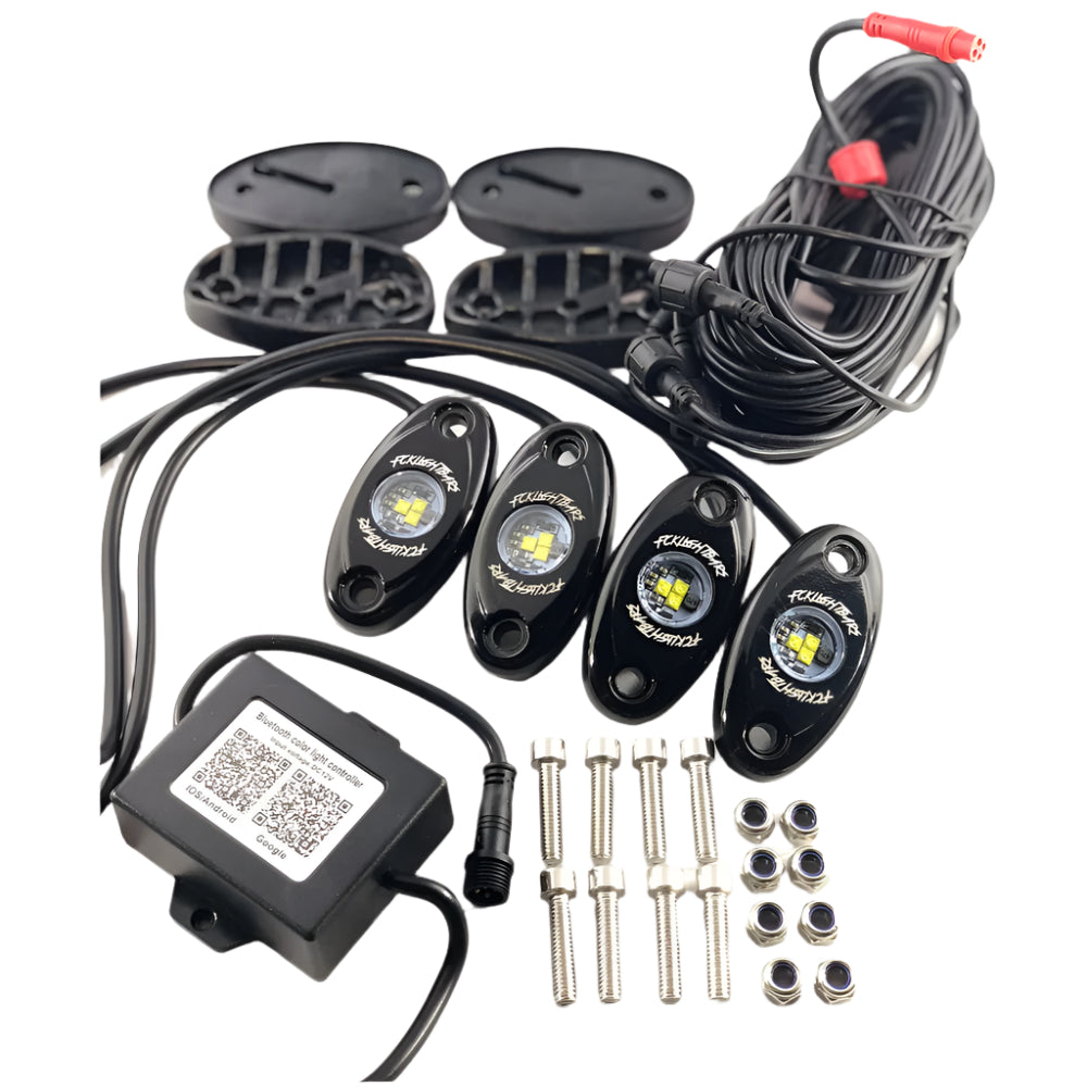 Four RGB rock lights with mounting pads, wiring, and remote controller