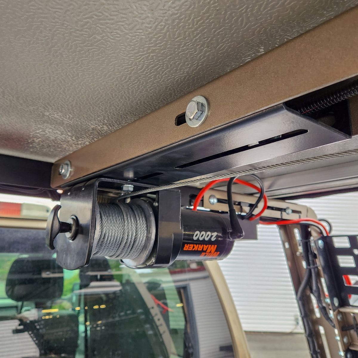 HMOR ROCK-IT Winch Mount installed under bed rack with 2000 lb winch, side view