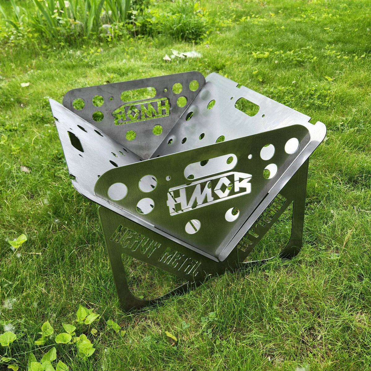 HMOR Collapsible Fire Pit assembled on grass, front three-quarter view